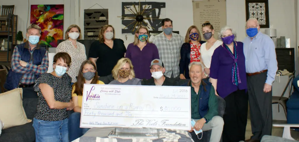 The Voila Foundation Presenting Sunshine on a Ranney Day With Their Check