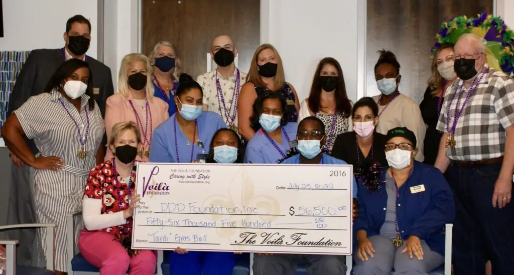 The Voila Foundation Presenting DDD Foundation With Their Check