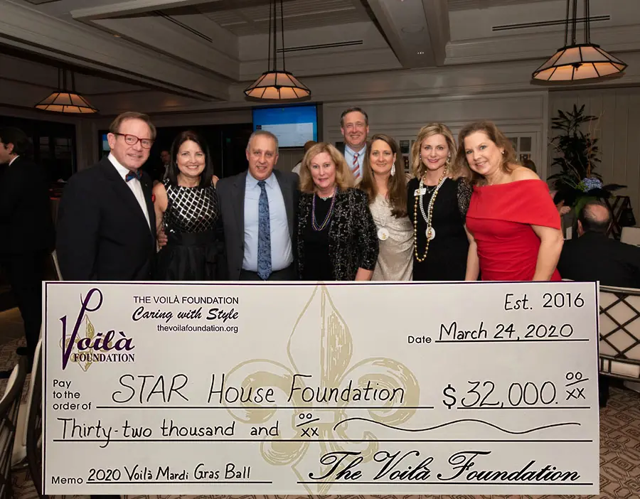 The Voila Foundation Presenting STAR House Foundation With Their Check