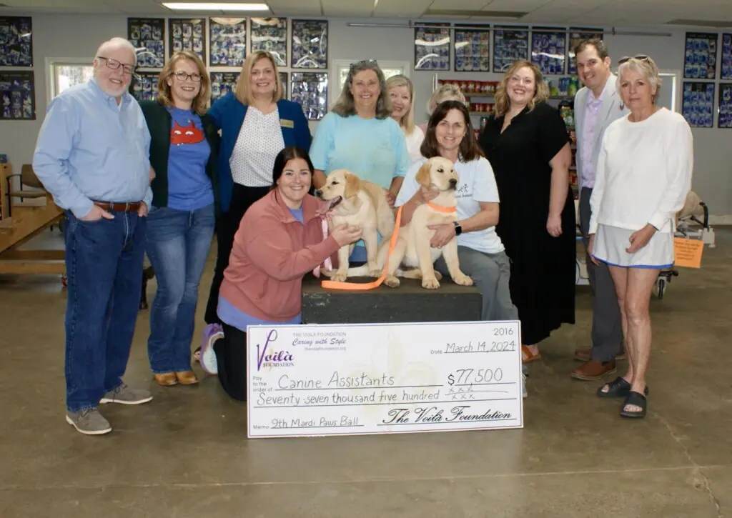 The Voila Foundation Presenting Canine Assistants With Their Check